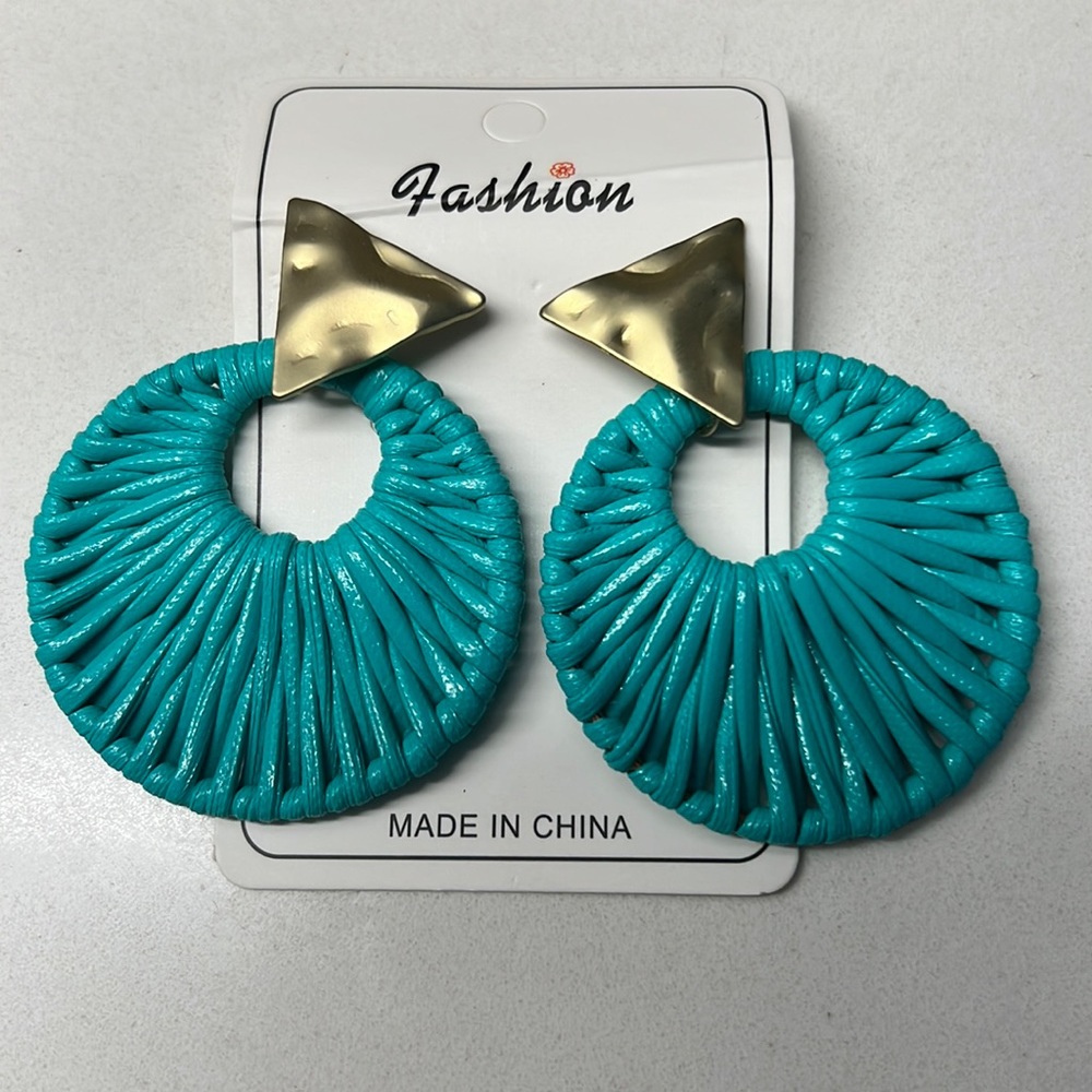 Teal rattan earrings with gold accent. NBW